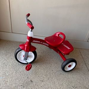 Two gently used Radio Flyer rider trikes for sale